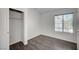 Cozy bedroom with closet, hardwood floor, and window bringing in natural light at 7898 Rye Canyon Dr, Las Vegas, NV 89123