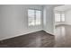 Bright bedroom boasts neutral walls, hardwood floors, and a window for natural light at 7898 Rye Canyon Dr, Las Vegas, NV 89123