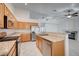 Bright kitchen featuring stainless steel appliances, granite countertops and an open layout into the living area at 7898 Rye Canyon Dr, Las Vegas, NV 89123