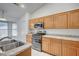 Kitchen with stainless appliances, wooden cabinets and a large window for natural light at 7898 Rye Canyon Dr, Las Vegas, NV 89123