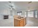 Open kitchen with stainless appliances, granite counters and view into the living space at 7898 Rye Canyon Dr, Las Vegas, NV 89123