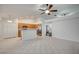 Open kitchen with tile flooring, wood cabinets, and stainless steel appliances at 7898 Rye Canyon Dr, Las Vegas, NV 89123