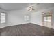 Spacious living room with hardwood floors, lots of natural light, and vaulted ceilings at 7898 Rye Canyon Dr, Las Vegas, NV 89123