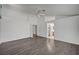 Spacious bedroom with hardwood floors, ceiling fan and access to an ensuite bathroom at 7898 Rye Canyon Dr, Las Vegas, NV 89123