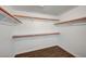 Spacious walk-in closet with ample shelving and dark hardwood floors at 7898 Rye Canyon Dr, Las Vegas, NV 89123