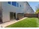 Backyard with artificial turf, private patio and storage shed at 8125 Monsoon Bay St, Las Vegas, NV 89113