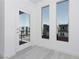 Balcony featuring large windows and door showing neighborhood view at 8125 Monsoon Bay St, Las Vegas, NV 89113