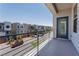 Balcony boasts views of the neighborhood and street showcasing modern architecture at 8125 Monsoon Bay St, Las Vegas, NV 89113