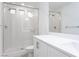 Modern bathroom featuring a glass enclosed shower and a vanity with a white countertop at 8125 Monsoon Bay St, Las Vegas, NV 89113