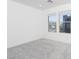 Bright bedroom with neutral carpet and large windows offering neighborhood views at 8125 Monsoon Bay St, Las Vegas, NV 89113