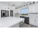 Bright kitchen with a large island, stainless steel appliances, and a view at 8125 Monsoon Bay St, Las Vegas, NV 89113