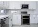 Updated kitchen featuring stainless steel appliances and white cabinetry at 8125 Monsoon Bay St, Las Vegas, NV 89113