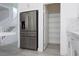Modern kitchen features stainless steel appliances, a walk-in pantry, and sleek white cabinetry at 8125 Monsoon Bay St, Las Vegas, NV 89113