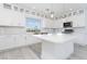 Well-lit kitchen with stainless steel appliances, island, and scenic view at 8125 Monsoon Bay St, Las Vegas, NV 89113