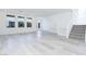 Open living room with natural light, hardwood floors, and staircase at 8125 Monsoon Bay St, Las Vegas, NV 89113