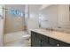 Bathroom with a single sink vanity, a shower-over-tub, and modern fixtures for comfortable living at 8732 Kendall Brook Cir, Las Vegas, NV 89149
