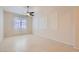 Minimalist bedroom with a window and tile floors, offering a blank canvas at 8732 Kendall Brook Cir, Las Vegas, NV 89149