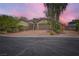 Charming home with a two-car garage, RV parking, and a well-manicured front yard at 8732 Kendall Brook Cir, Las Vegas, NV 89149