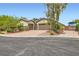 Charming home with a two-car garage, RV parking, and a well-manicured front yard at 8732 Kendall Brook Cir, Las Vegas, NV 89149
