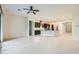 Bright open-concept living area with modern kitchen and tile flooring, great for entertaining at 8732 Kendall Brook Cir, Las Vegas, NV 89149