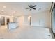 Open living area with kitchen and tiled flooring offers ample space for living and entertaining at 8732 Kendall Brook Cir, Las Vegas, NV 89149