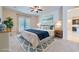 Inviting main bedroom with a plush bed, soft lighting, and a patio door leading to the outside at 8732 Kendall Brook Cir, Las Vegas, NV 89149