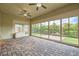 Bright sun room with brick flooring, a ceiling fan, and serene views of the backyard at 8732 Kendall Brook Cir, Las Vegas, NV 89149