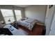 Well-lit bedroom features wood floors, and a desk for working from home at 8811 Tomnitz Ave # 101, Las Vegas, NV 89178