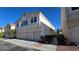 Inviting two-story townhouse with a three-car garage and well-maintained landscaping, perfect for a growing Gathering at 8811 Tomnitz Ave # 101, Las Vegas, NV 89178
