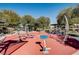 Outdoor fitness area offers various exercise equipment and shade at 8811 Tomnitz Ave # 101, Las Vegas, NV 89178