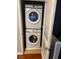 Convenient laundry closet with stacked washer and dryer units, maximizing space for efficient home maintenance at 8811 Tomnitz Ave # 101, Las Vegas, NV 89178