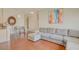Open-concept living area with hardwood floors, modern decor, and comfortable seating next to the kitchen area at 8811 Tomnitz Ave # 101, Las Vegas, NV 89178