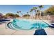 Large swimming pool with a decorative tile entry and a metal safety railing at 8811 Tomnitz Ave # 101, Las Vegas, NV 89178