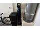 Image shows the water heater, water softener, and a bicycle at 8811 Tomnitz Ave # 101, Las Vegas, NV 89178