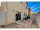 Exterior of the home showcasing a patio, gravel, and AC units at 8988 Winchester Ridge St, Las Vegas, NV 89139