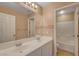 Bathroom featuring a double sink vanity and a full bathtub at 8988 Winchester Ridge St, Las Vegas, NV 89139