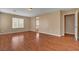 Bright, airy bedroom with wood floors and a large window, offering a view to the exterior at 8988 Winchester Ridge St, Las Vegas, NV 89139