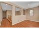 Spacious bedroom with hardwood floors and an open layout to the hallway at 8988 Winchester Ridge St, Las Vegas, NV 89139