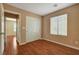 Bedroom with hardwood floors, closet, and a window at 8988 Winchester Ridge St, Las Vegas, NV 89139
