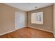 Bedroom with wood floors, window, and closet at 8988 Winchester Ridge St, Las Vegas, NV 89139