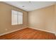 Well-lit bedroom with hardwood flooring and a bright window view at 8988 Winchester Ridge St, Las Vegas, NV 89139