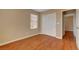 Clean bedroom with hardwood floors, closet, and a window at 8988 Winchester Ridge St, Las Vegas, NV 89139
