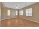 Bedroom with tile flooring, neutral walls, a ceiling fan and two windows providing lots of natural light at 8988 Winchester Ridge St, Las Vegas, NV 89139