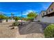 Neighborhood park with desert landscaping, trees and benches for relaxation at 8988 Winchester Ridge St, Las Vegas, NV 89139