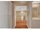 Bright hallway with wood floors and built in storage cabinets at 8988 Winchester Ridge St, Las Vegas, NV 89139