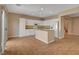 Spacious kitchen with white cabinets, granite counters, stainless appliances, and a center island at 8988 Winchester Ridge St, Las Vegas, NV 89139