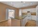 Kitchen featuring white cabinets, granite countertops, stainless appliances, and a center island at 8988 Winchester Ridge St, Las Vegas, NV 89139