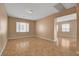 Bright, airy living room featuring neutral walls and tiled flooring, showcasing a comfortable and inviting atmosphere at 8988 Winchester Ridge St, Las Vegas, NV 89139