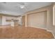 Large living room featuring ceramic tile, neutral walls, recessed lighting and an adjacent kitchen at 8988 Winchester Ridge St, Las Vegas, NV 89139