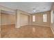 Living room featuring tile flooring, neutral walls, a ceiling fan, and an adjacent doorway at 8988 Winchester Ridge St, Las Vegas, NV 89139